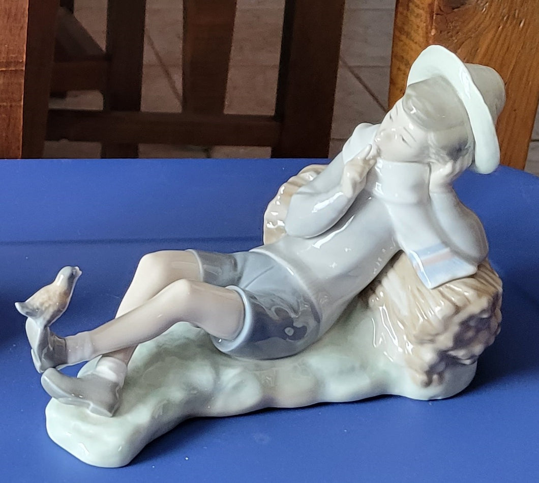 Lladro Porcelain Boy Sitting With Bird Figurine